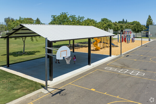 Students play basketball at Cox Elementary School in Clovis.