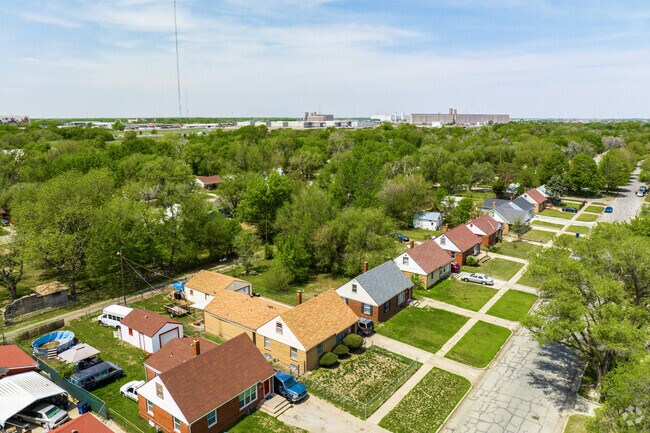 The homes in Power are surrounded by tall trees.