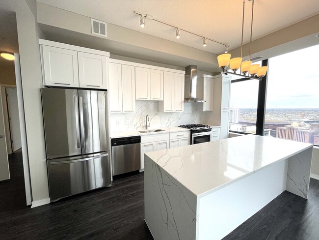 Nic on 5th Apartments- The Olivia floorplan with marble granite countertops, great lighting design and views of Downtown West Minneapolis