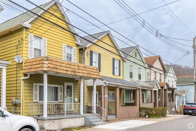 Some homes in Pitcairn have pops of color that add to the street.