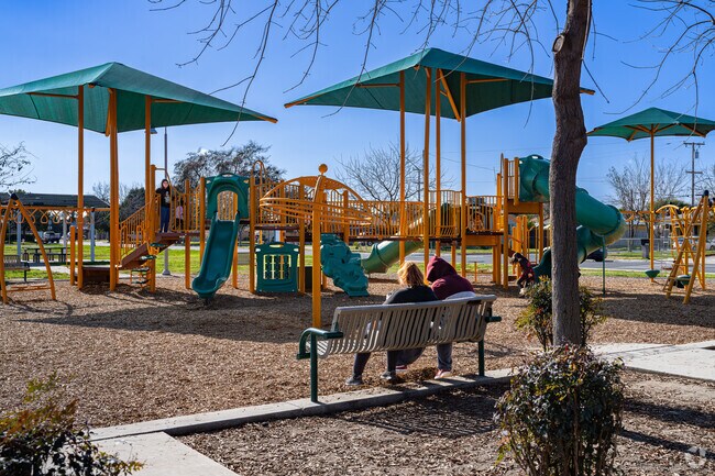 Children enjoy the new shaded play equipment at Mulcahy Park in Tulare.