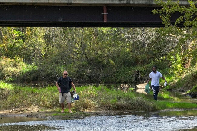 Locals fish the Green River as it flows through David Shapiro Park in Amboy.