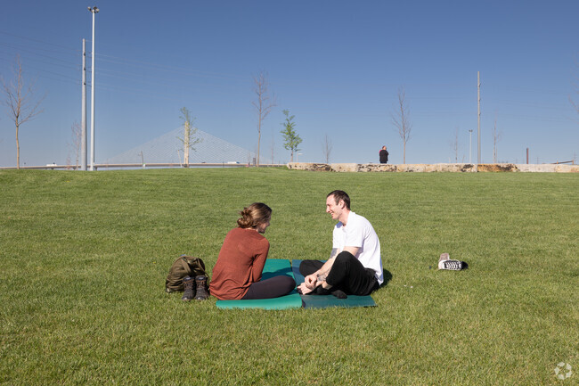 Glass City Metropark's lawn is the perfect spot to relax with friends.