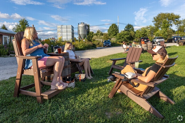 Enjoy a cold brew at Rising Silo Brewery while watching the sunset in Tom's Creek.