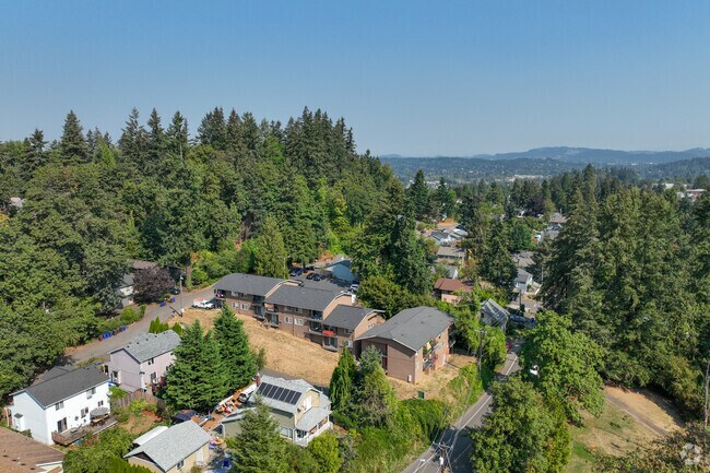 The elevated views in Rivercrest offer scenic glimpses of nearby forests and hills.