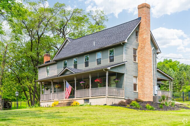 Modern farmhouses feature expansive front porches in Hepburn Township.
