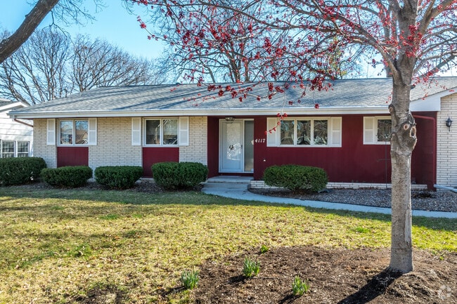Older ranches stretch out in their large yards in central Meredith.