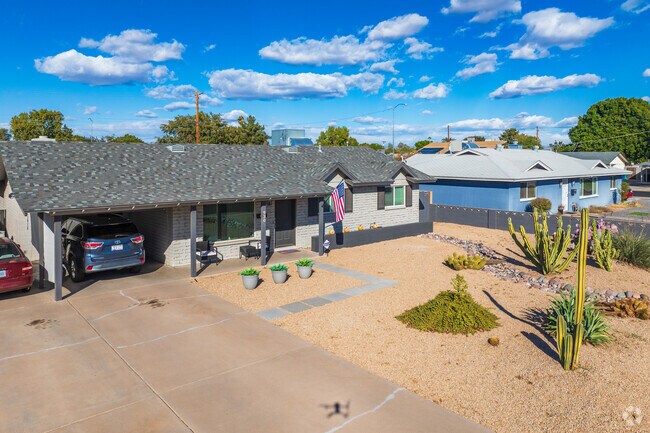 Many homes in Evergreen Historic District feature xeriscaped front yards.