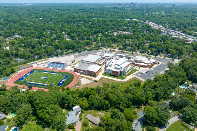 Aerial context shot from back side of school.