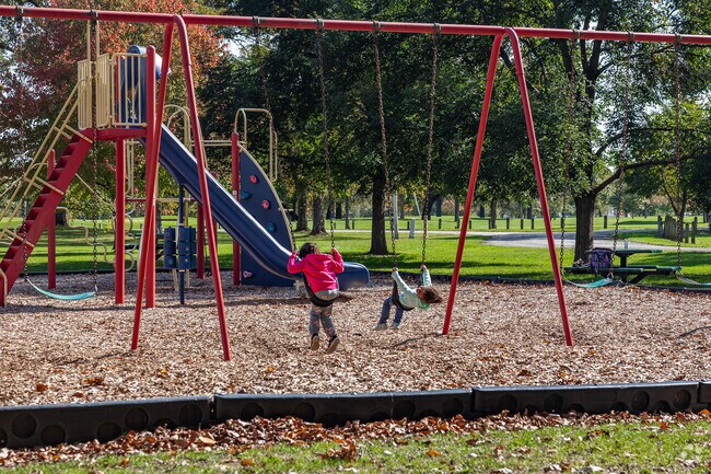 Kids love the playground swings at McMillen Park in Fort Wayne.