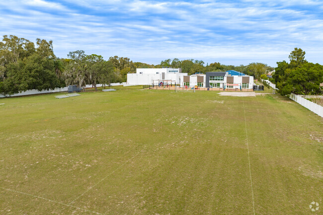 Kids enjoy outdoor play on the open fields at Hillel Academy of Tampa.