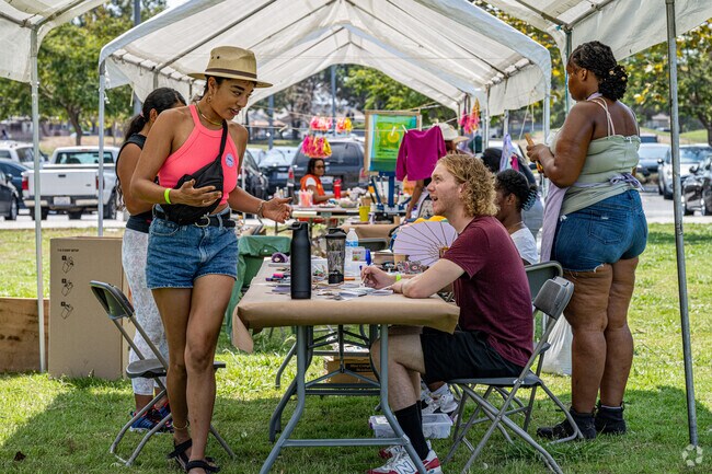 Locals gather to paint and write at the Music Inspires Art event in Willowbrook.