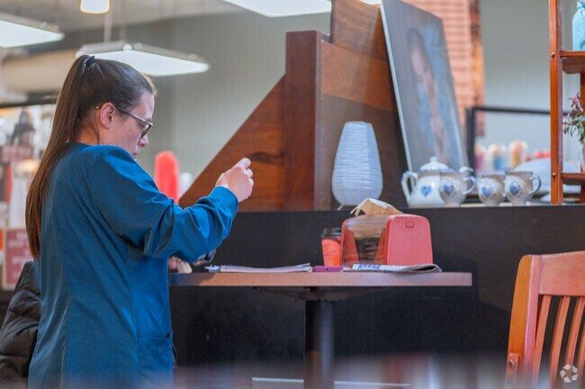 A patron enjoys a coffee during their busy day at Fay's Evelyn Bay Coffee in Charlotte.