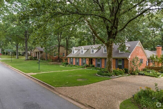 Brick minimal traditional-style homes line River Mountain in Little Rock.