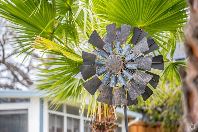 Homes in Swanston Estates display creative front-yard art like this windmill.