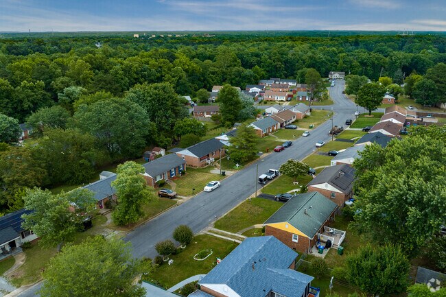 Brick and vinyl-style homes perfectly spaced a part in the lovely neighborhood of Walmsley.