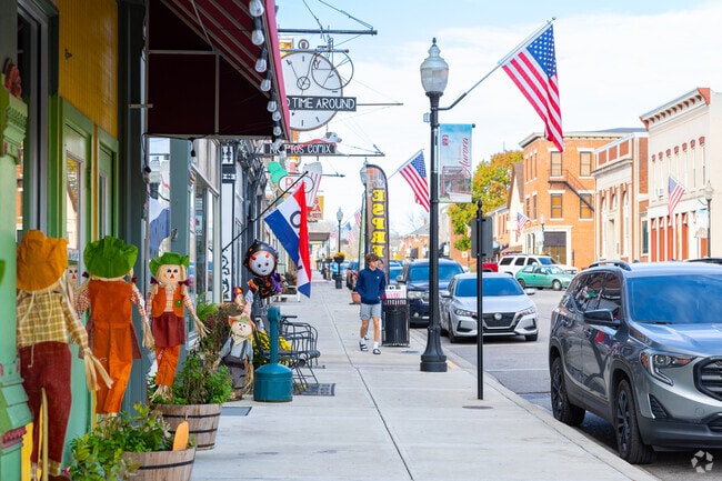Main Street in the center of Aurora has many flags and signs to attract visitors.