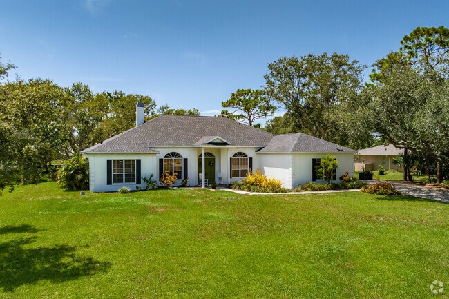 In Boca Royale, find some homes with large yards surrounding a custom home.