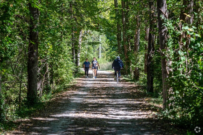 Residents walk the MKT Trail in Flat Branch Park near North Central, Columbia.