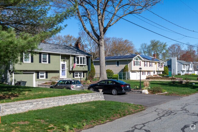 Different roofline styles characterize the framework of raised ranch homes in North Swansea.