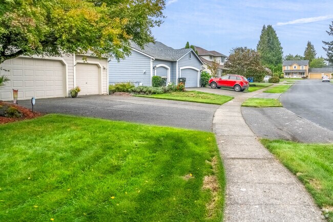 A row of minimal traditional homes in a quiet street in North East Olympia.