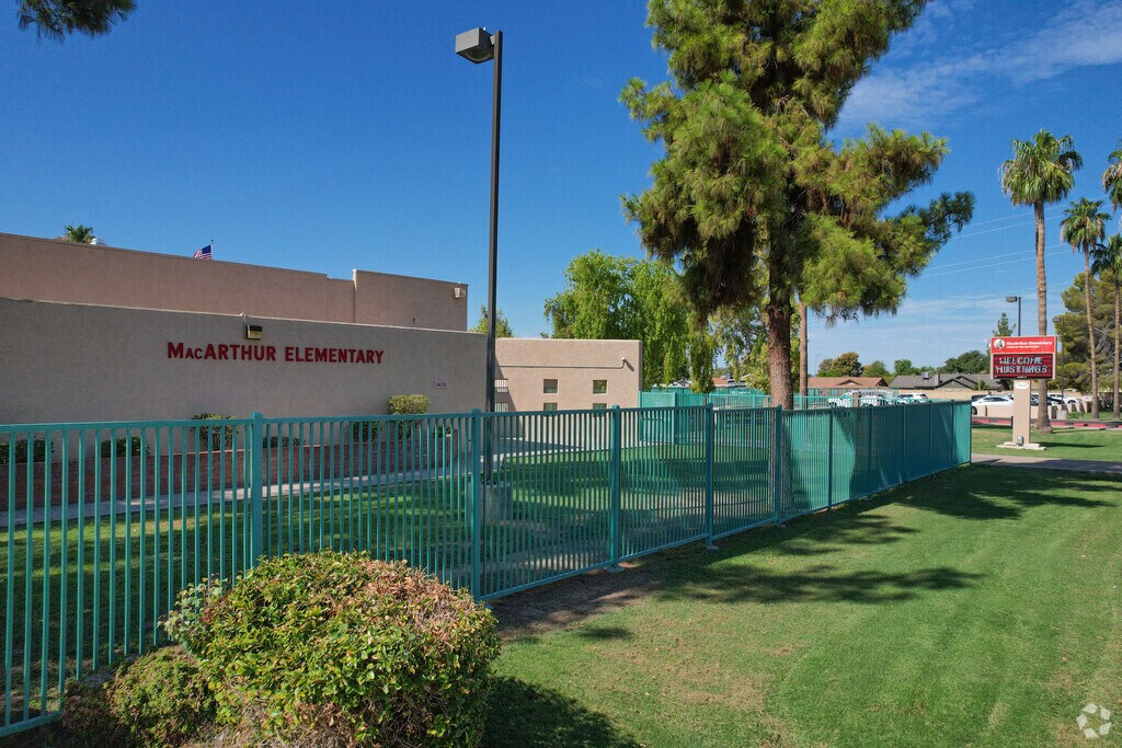 MacArthur Elementary has multiple sports courts and a large athletic field for its students.
