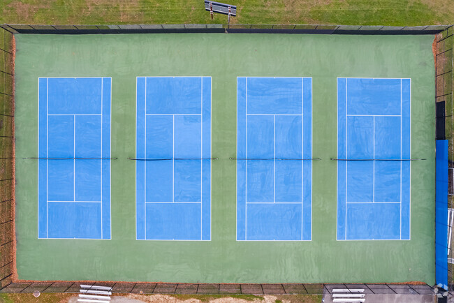 Students enjoy playing tennis on the tennis courts at Rye Neck High School in Mamaroneck.
