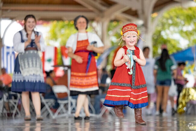 Kids enjoy dancing to the music at the International Food Festival in Old Town Manassas.