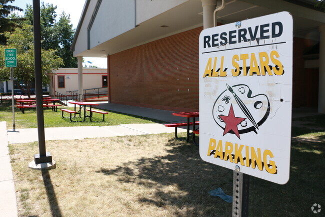 Parking lot signs at Adams Elementary School.