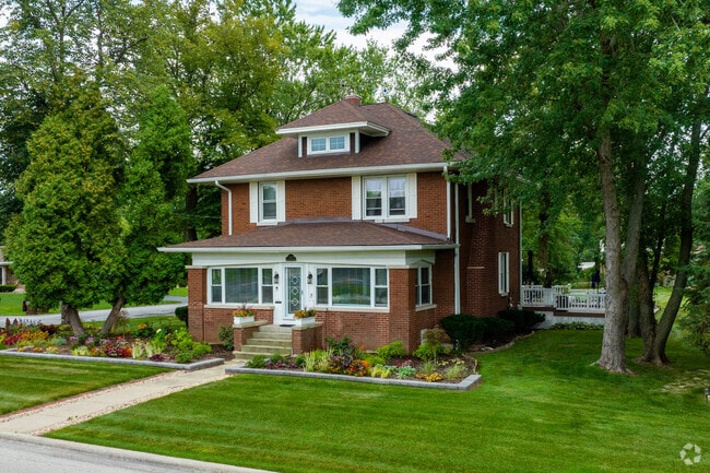 Well maintained four square style brick homes are found in Olympia Fields.