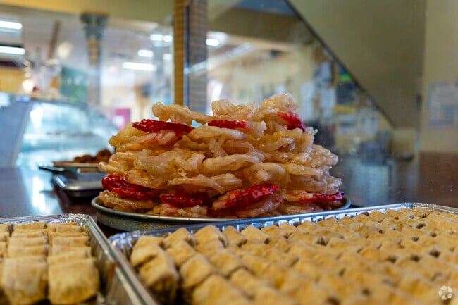 Fresh baklava and baked goods are available at New Yasmeen Bakery in Oakman Grove.