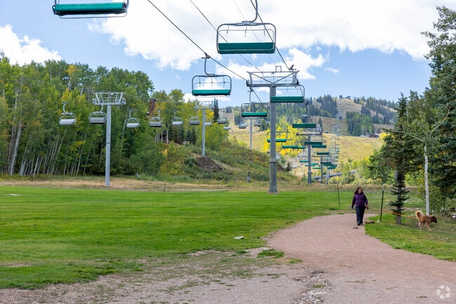 Chairlifts at Snowmass provide access to varied ski and snowboard runs.