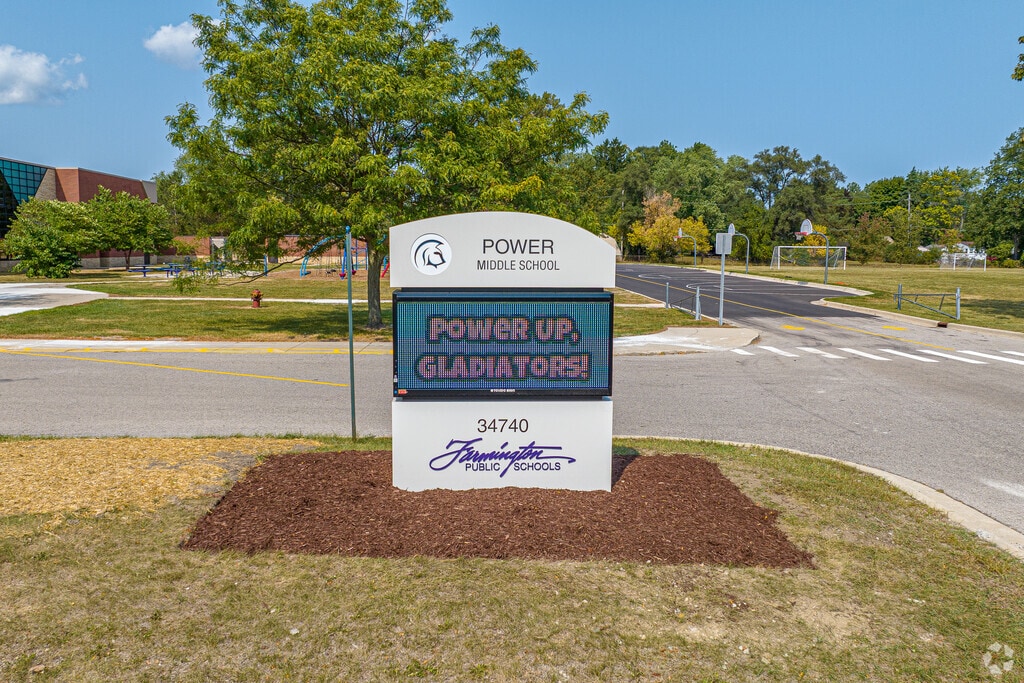 Entrance sign of Power Middle Schools shows text for possible events for the students.