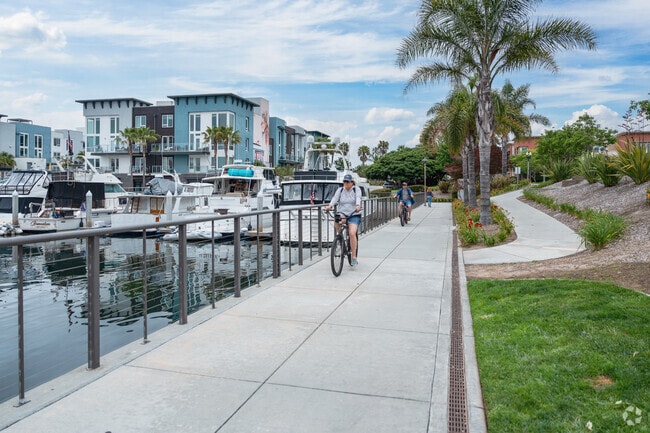 Bicyclist enjoy a ride along the marina in Channel Islands.
