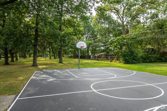 Greencrest Park offers shaded fields for picnics and athletic facilities for active locals.
