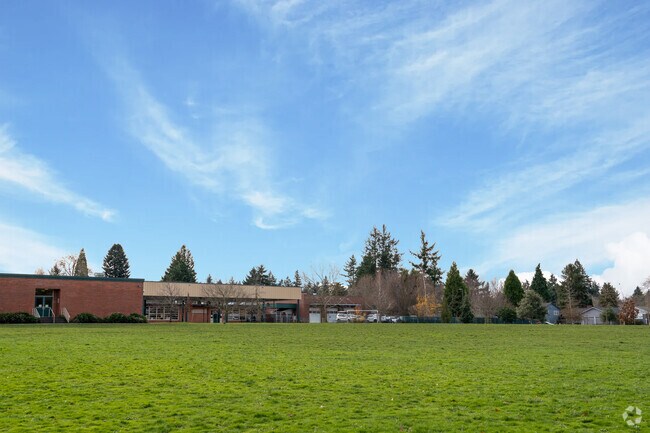 A sports field sits behind the campus.