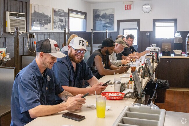 Behr Den plates hot breakfast in a diner setting.