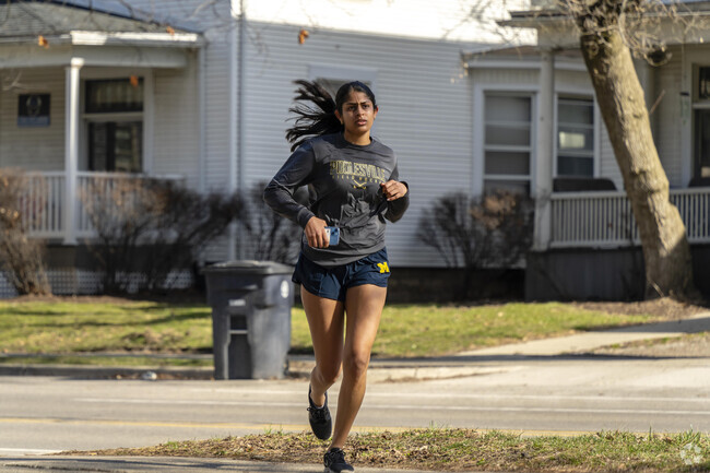 Locals run through Forsythe Park in the Yost neighborhood.