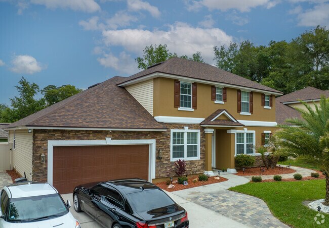 Two-story stucco home that also has a nicely landscaped yard in the Gilmore-Beacon Hills.