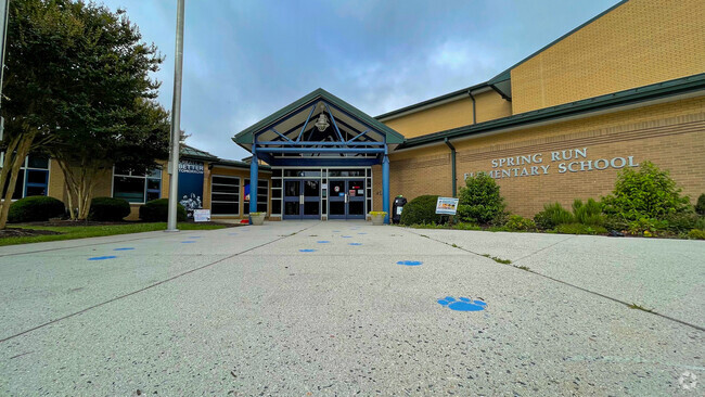 The Spring Run Elementary School mascot's footprints lead toward the school's front entrance.
