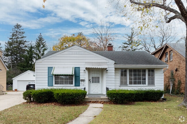 Modest single-family homes in Glenwood Heights boast manicured hedges and tidy front yards.
