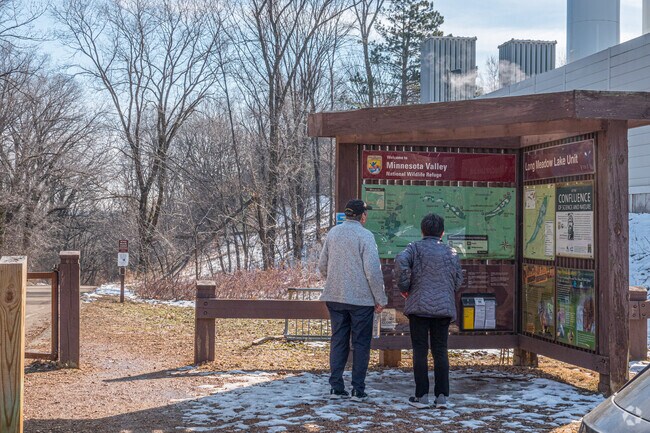 visitors planning out a trail walk at the wildlife refuge in the South Loop neighborhood.