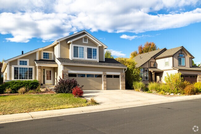 Two-story homes with three-car garages line the Red Hawk neighborhood.