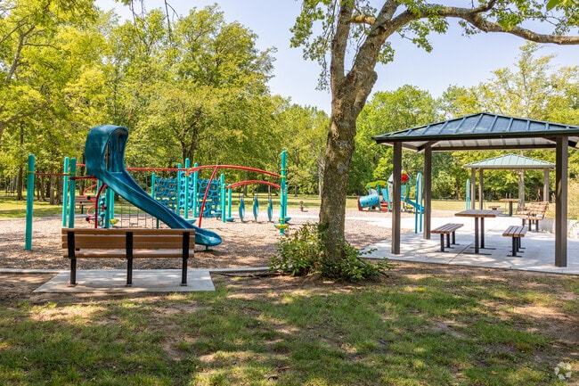 Discover tranquility at Plaza Tract Park, a green oasis within the heart of Tower Heights.