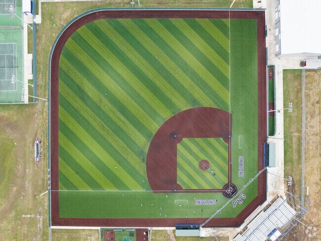 Students take the field for practice at Port Neches-Groves High School.