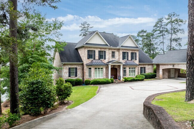 This stately home displays the traditional design elements of a Cottage-design.