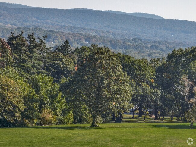 Read a book and enjoy the captivating views at Walnut Hill Park. in New Britain