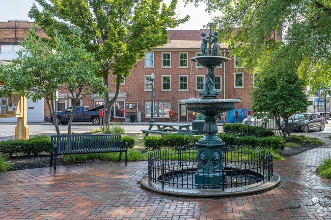 A water fountain in the town square is inviting on a hot day in Lisbon.