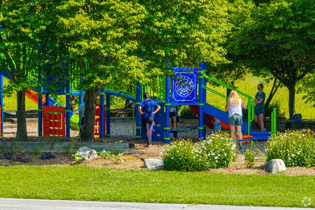 Jesco Hills Estates parents watch over their littles at the Munger Park playground.