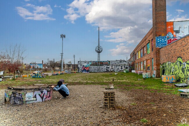 Elijah McCoy local artist, builds his art installation at Lincoln Street Art Park.